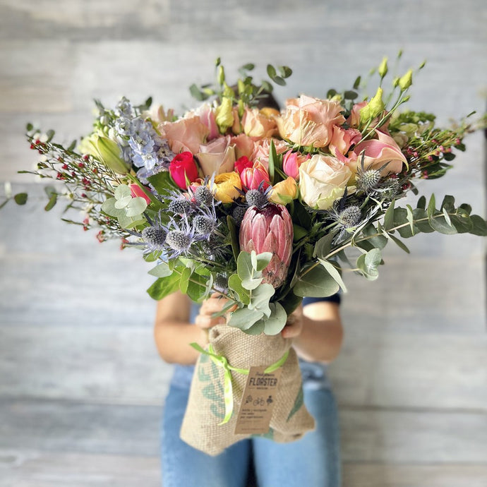 Big bouquet with proteas, roses, tulips.